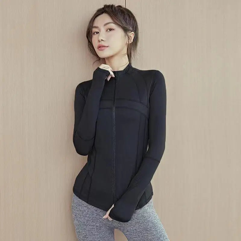 Woman wearing black sleek fit yoga jacket for workouts and summer jogging