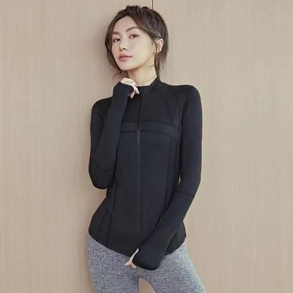 Woman wearing black sleek fit yoga jacket for workouts and summer jogging