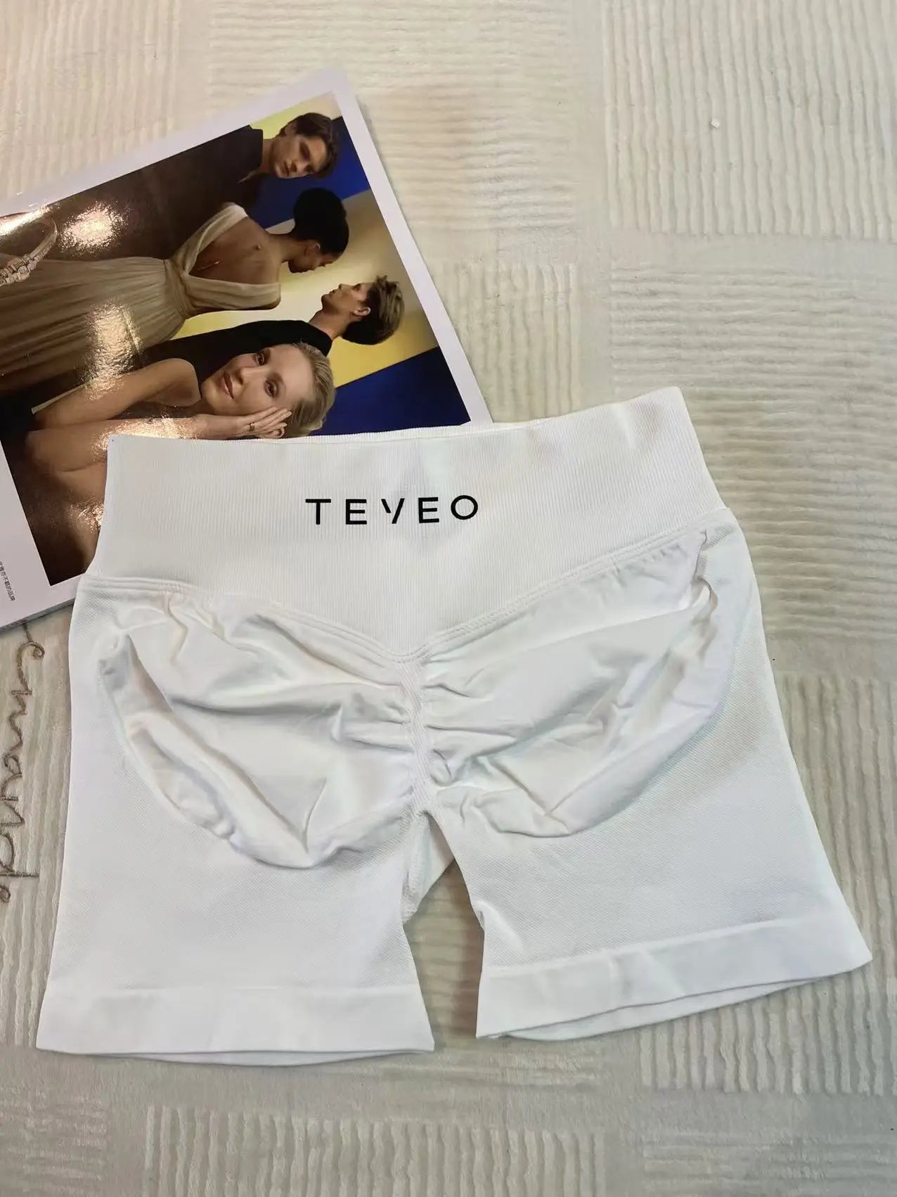white soft, breathable yoga shorts in a high-waisted fit—perfect for workouts, yoga, or relaxed summer days.