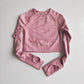 long-sleeve yoga crop top with a built-in bra in pink—perfect for workouts, yoga sessions, or summer activewear.