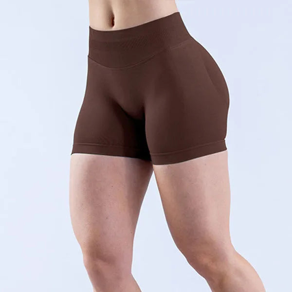 woman wearing a soft, breathable yoga shorts in a high-waisted fit—perfect for workouts, yoga, or relaxed summer days.