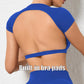Woman wearing a blue backless workout crop top with breathable, stretchy fabric — perfect for running, gym workouts, cycling, and outdoor activities.