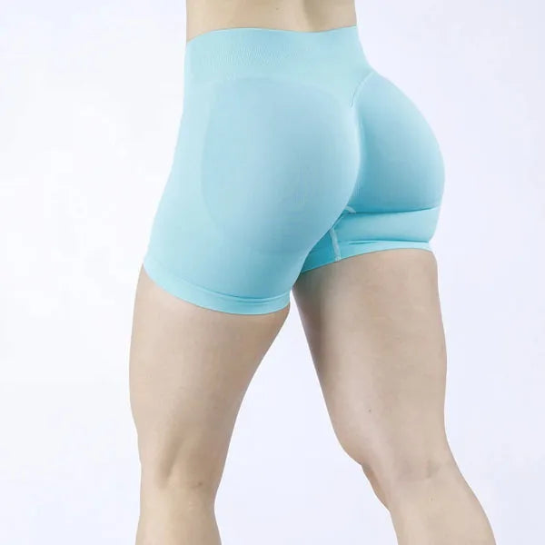 woman wearing a blue soft, breathable yoga shorts in a high-waisted fit—perfect for workouts, yoga, or relaxed summer days.