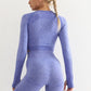 Woman wearing a long-sleeve yoga crop top with a built-in bra in lavender blue—perfect for workouts, yoga sessions, or summer activewear.