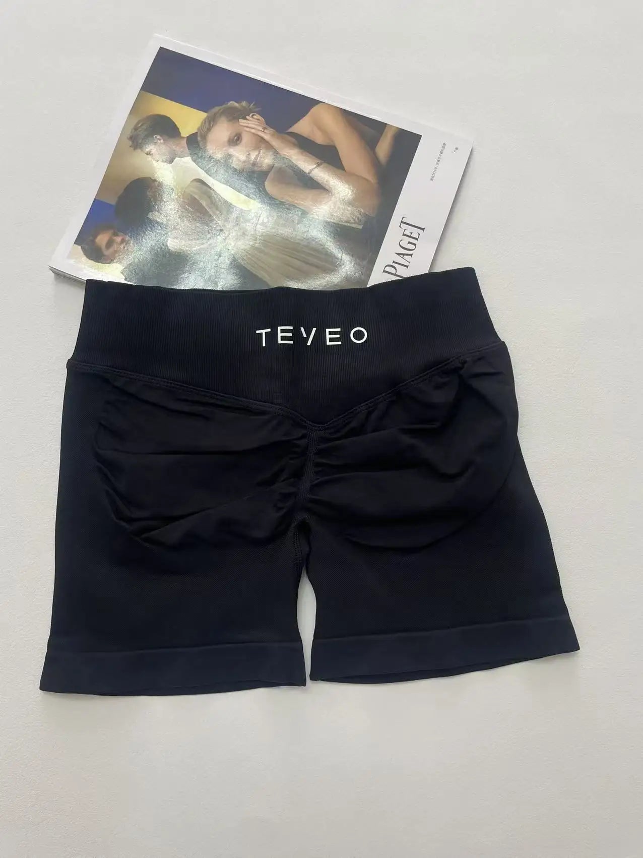 black soft, breathable yoga shorts in a high-waisted fit—perfect for workouts, yoga, or relaxed summer days.