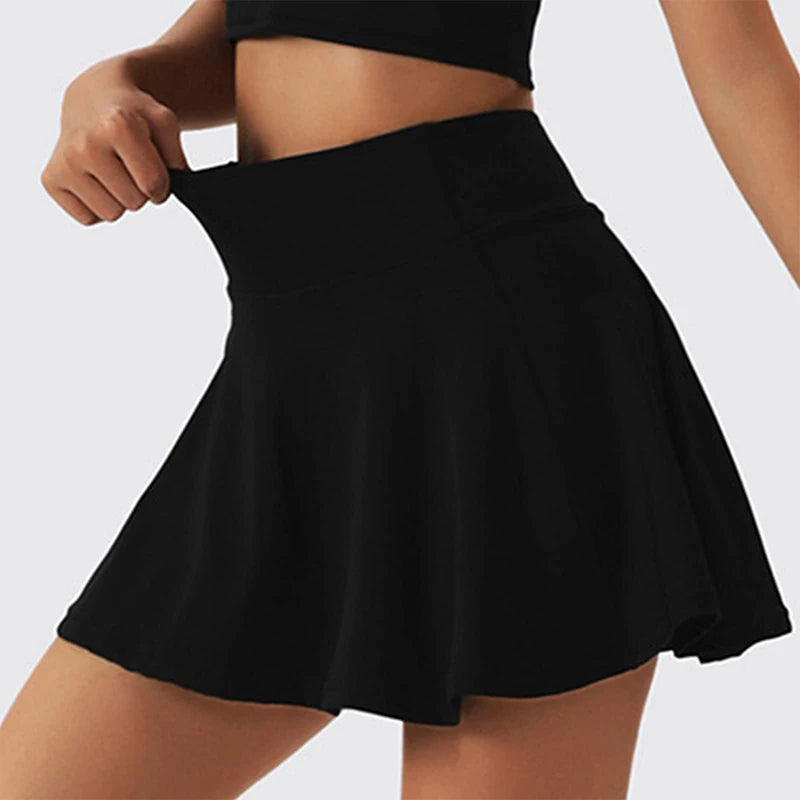 Woman wearing white high-waist skort with hidden pocket and built-in shorts