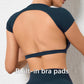 Woman wearing a backless workout crop top with breathable, stretchy fabric — perfect for running, gym workouts, cycling, and outdoor activities.