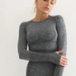 Woman wearing a long-sleeve yoga crop top with a built-in bra in brown—perfect for workouts, yoga sessions, or summer activewear.