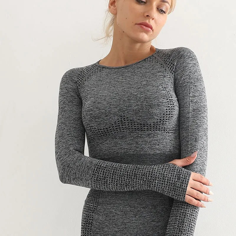 Woman wearing a long-sleeve yoga crop top with a built-in bra in brown—perfect for workouts, yoga sessions, or summer activewear.