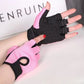 A pair of pink fingerless gloves being worn, designed for cycling with a focus on the gloves and part of the bike handle.
