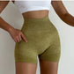 Woman wearing seamless high-waisted workout shorts in a slim, stretchy fit—ideal for yoga, gym, and activewear.